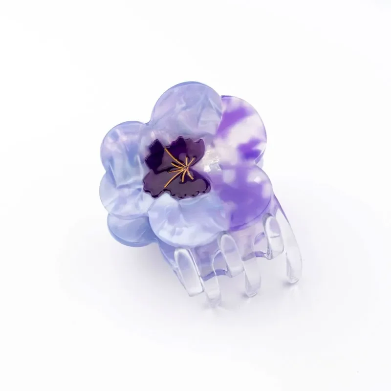 Coucou Suzette Pansy Hair Claw in glossy cellulose acetate, a delicate French flower hair accessory curated by Goosebump.