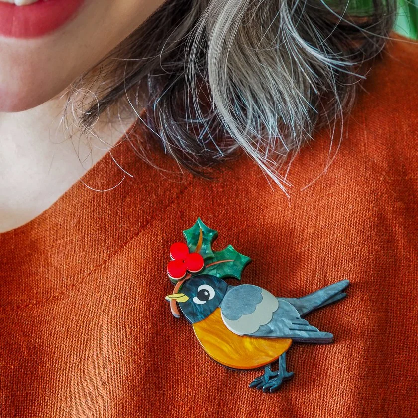 Erstwilder Ruby the Robin Brooch with holly berries, festive robin design in layered resin. Ideal Christmas accessory for nature lovers and vintage style fans.