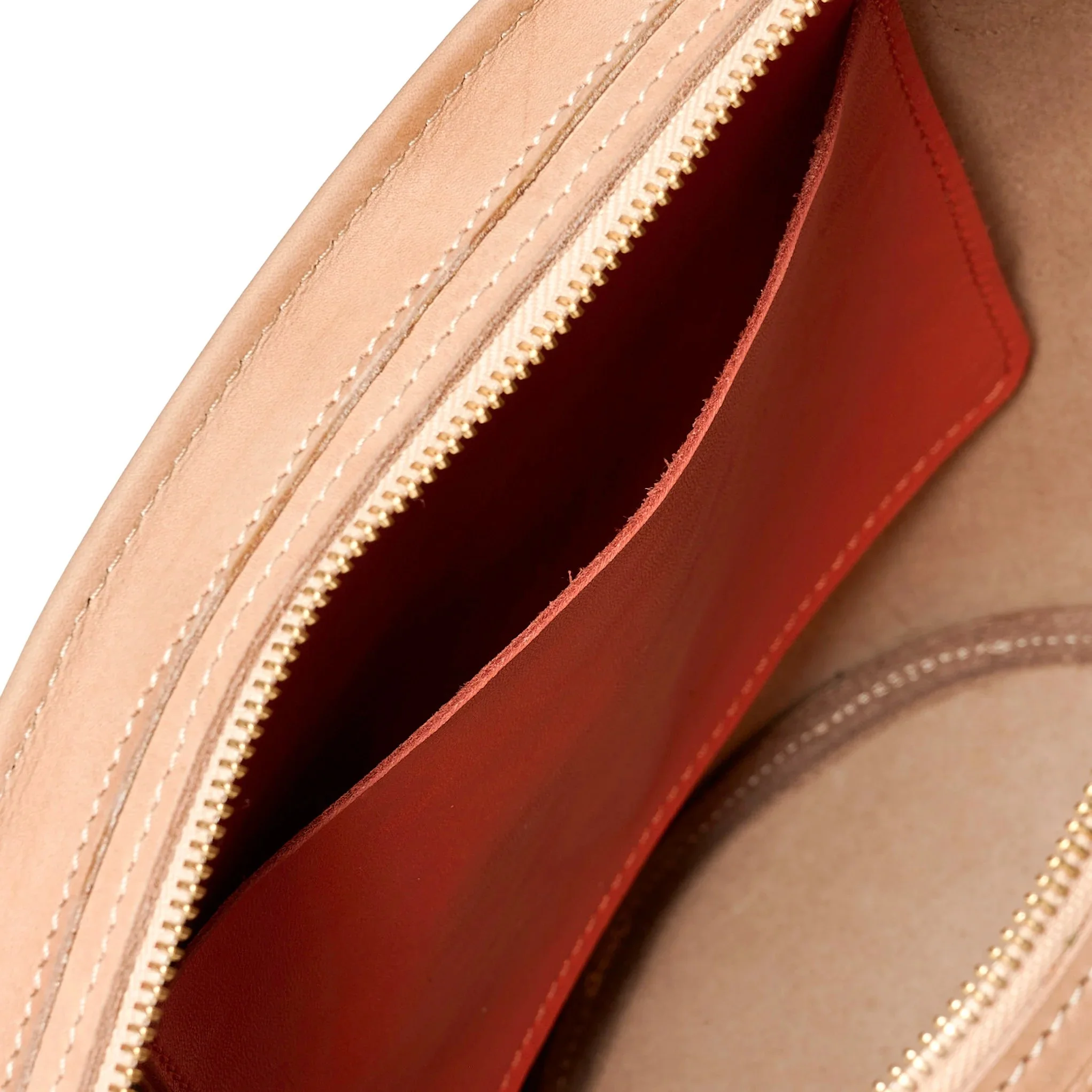 Almond and lobster red Emele Bag by Project Dyad, handmade in Cape Town with a curved silhouette and structured pleats.