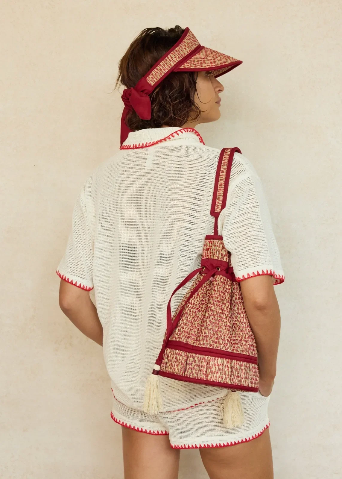 Model carrying the Lorna Murray Bouquet Midi Leisure Tote over the shoulder, showcasing its lightweight handcrafted woven design.