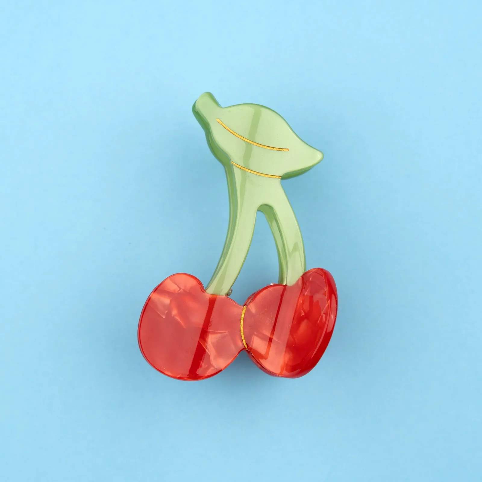 Coucou Suzette Cherry Hair Claw in glossy cellulose acetate, a playful French fruit-inspired hair accessory curated by Goosebump.