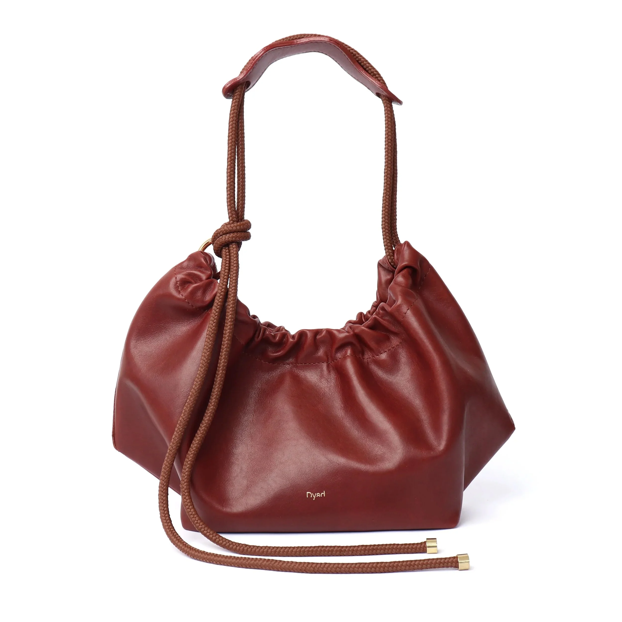 Brown Flora Bag with tulip-inspired shape and rope strap, handmade in Cape Town using full-grain leather and Italian magnetic closure.