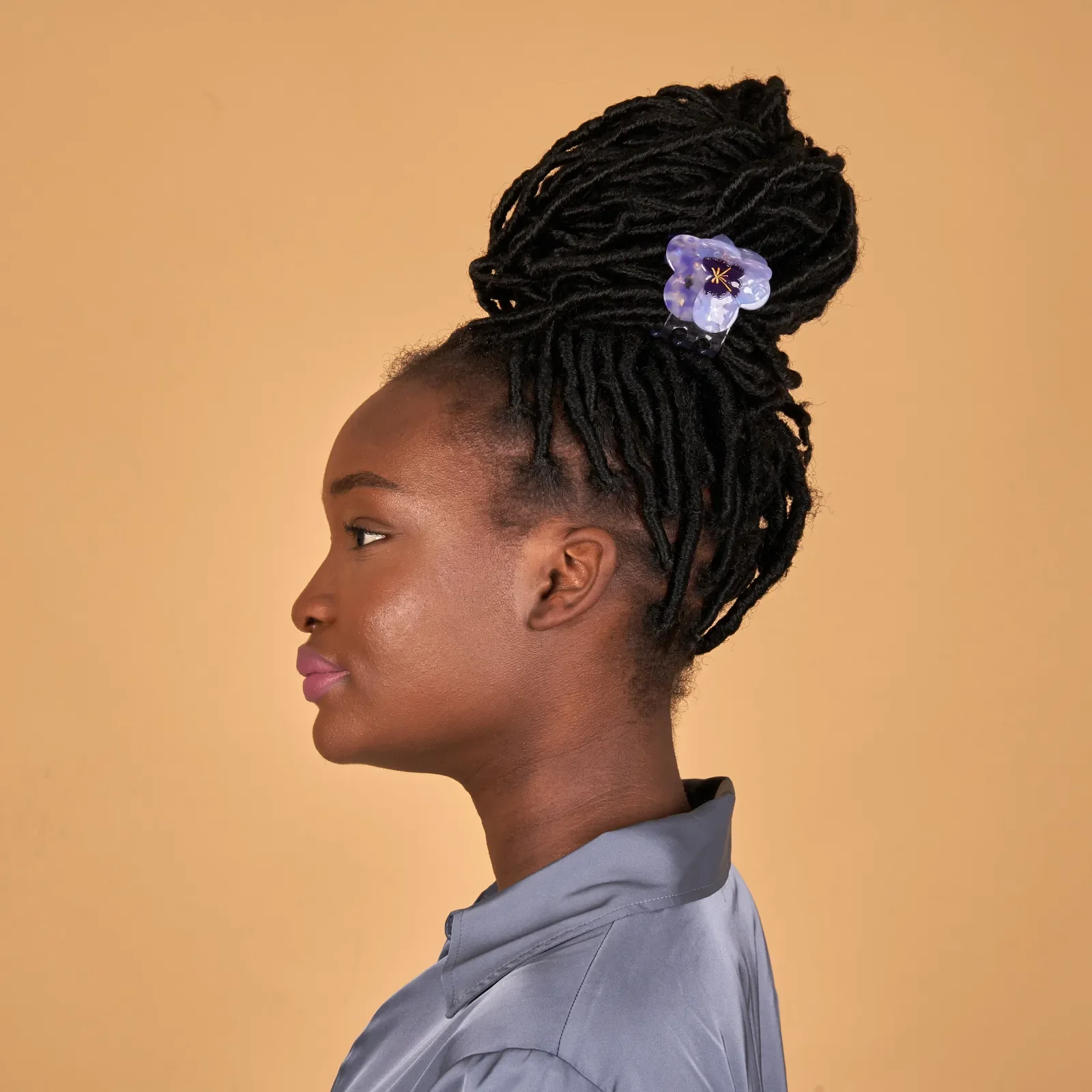 Coucou Suzette Pansy Hair Claw in glossy cellulose acetate, a delicate French flower hair accessory curated by Goosebump.