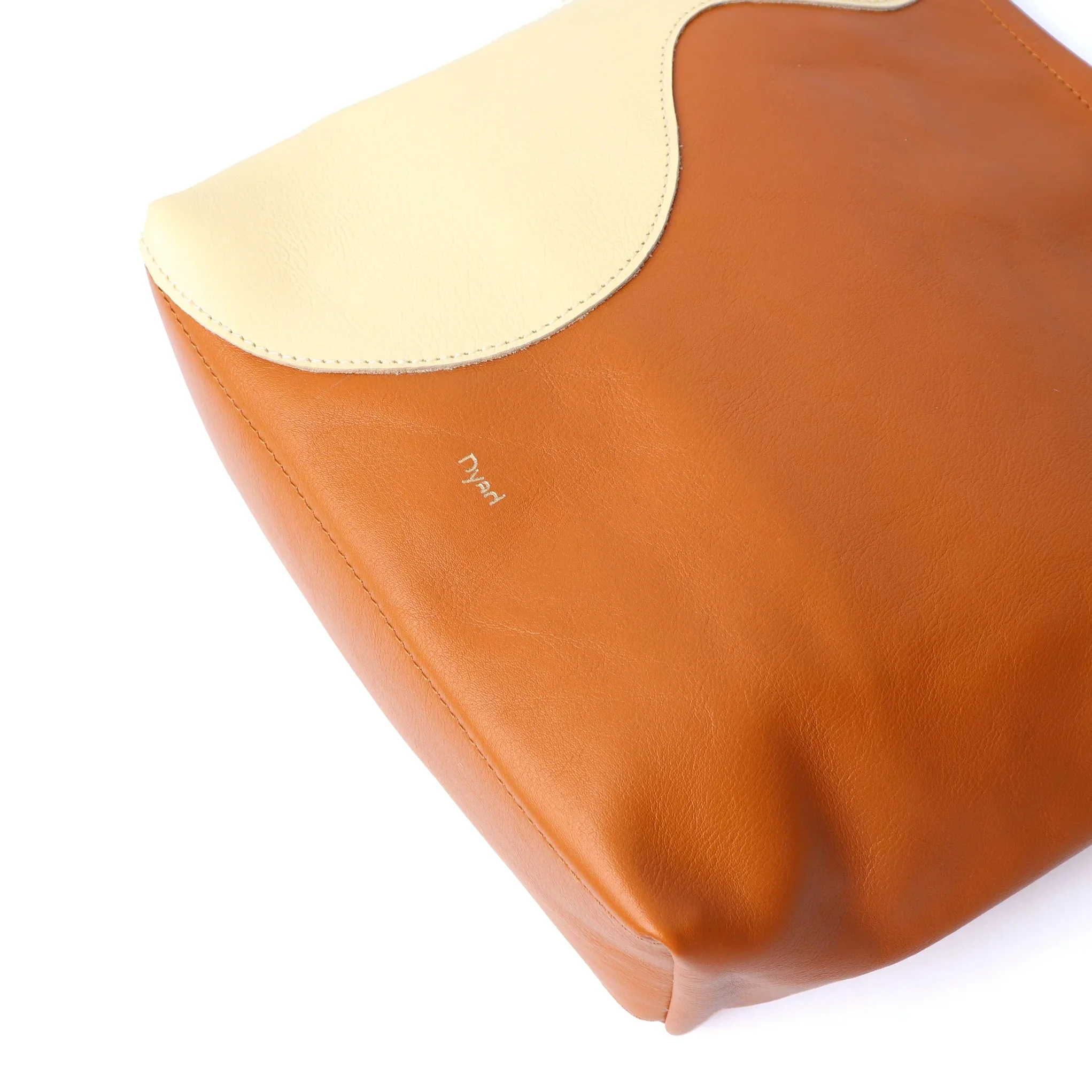 Tan and butter ripple canvas tote bag by Project Dyad, handmade with sculptural folds and cotton straps.