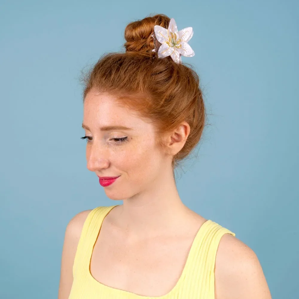 Coucou Suzette Lily Hair Claw in glossy cellulose acetate, an elegant French flower hair accessory curated by Goosebump.