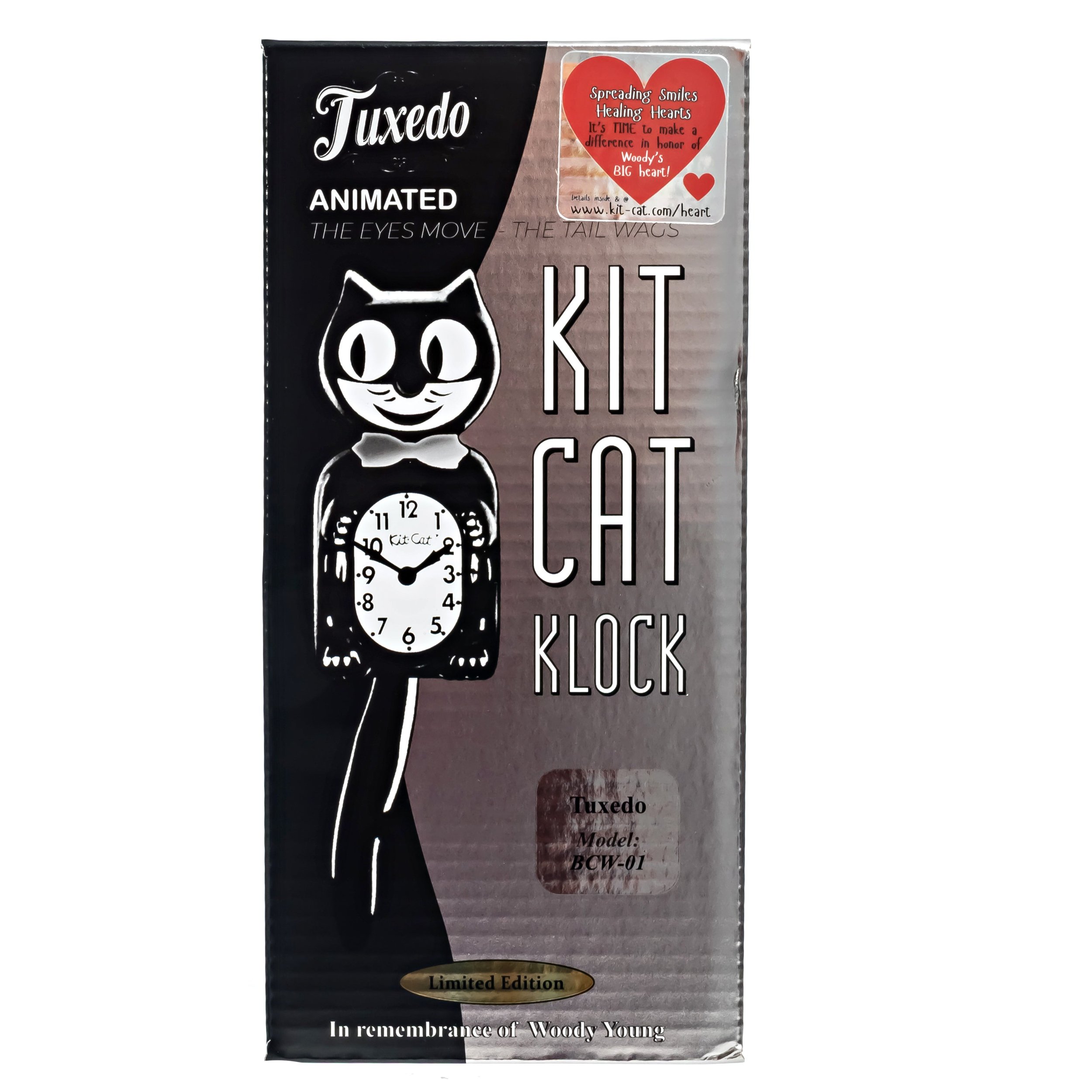 Tuxedo Kit-Cat Klock with black body, ivory belly, chrome bow tie, moving eyes and wagging tail, available at Goosebump Hong Kong.