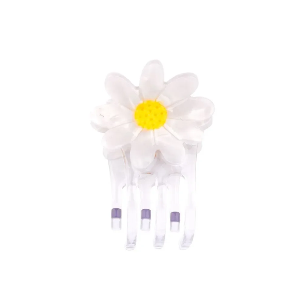 Coucou Suzette Mini Daisy Hair Claw in glossy cellulose acetate, a sweet French flower hair accessory curated by Goosebump.