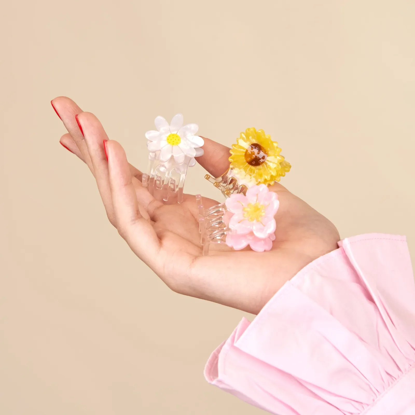 Coucou Suzette Mini Daisy Hair Claw in glossy cellulose acetate, a sweet French flower hair accessory curated by Goosebump.