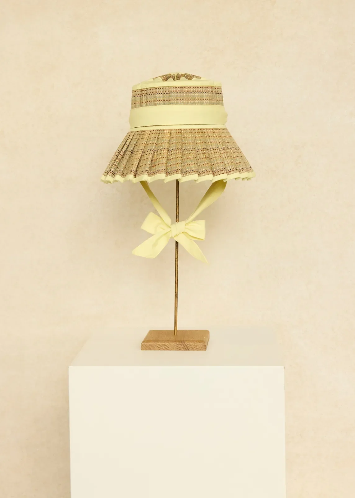 Lorna Murray Jubilee Island Seven Seas Hat front view with a wide pleated brim, lemon cream trim and ties.