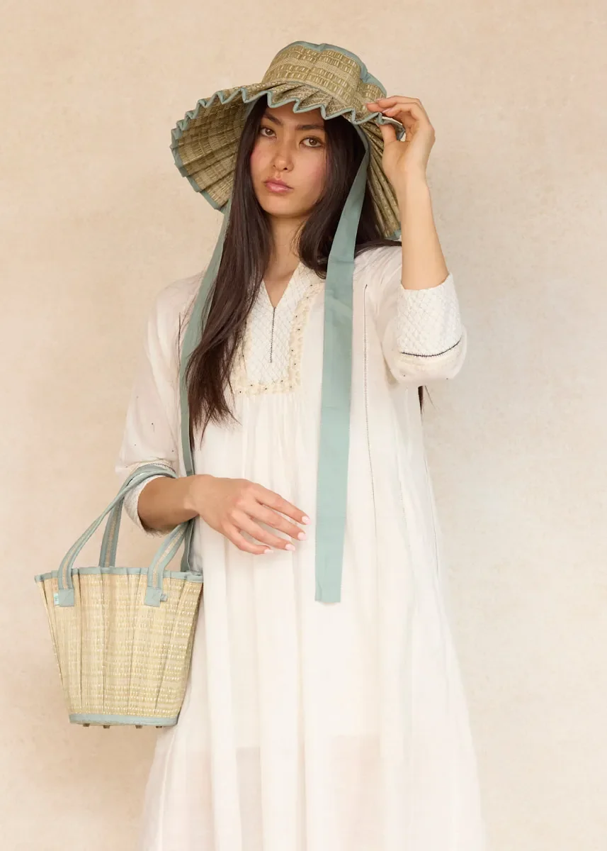 Model carrying the Lorna Murray Polynesia Mini Tropez Tote, highlighting its lightweight size and everyday styling.