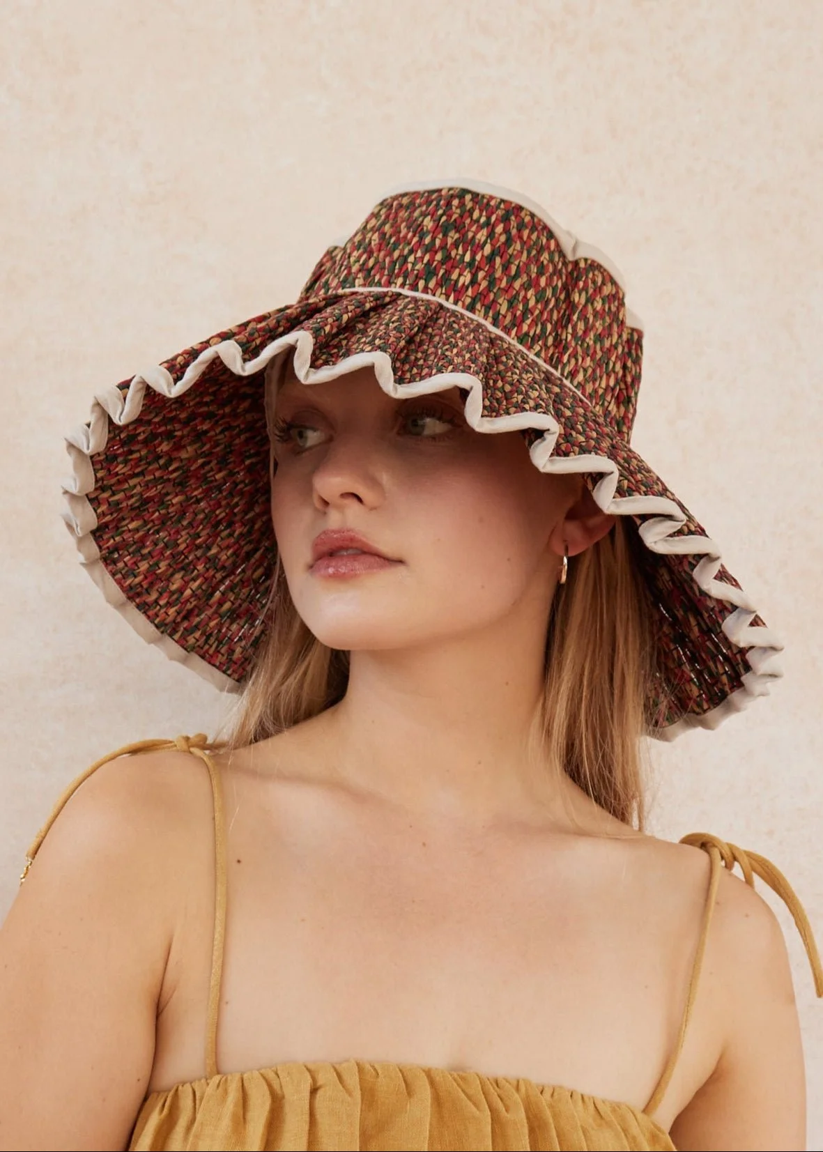 Nomad Island Capri Hat – handwoven palm leaf foldable sun hat with wide brim in neutral tones, available at Goosebump Hong Kong.