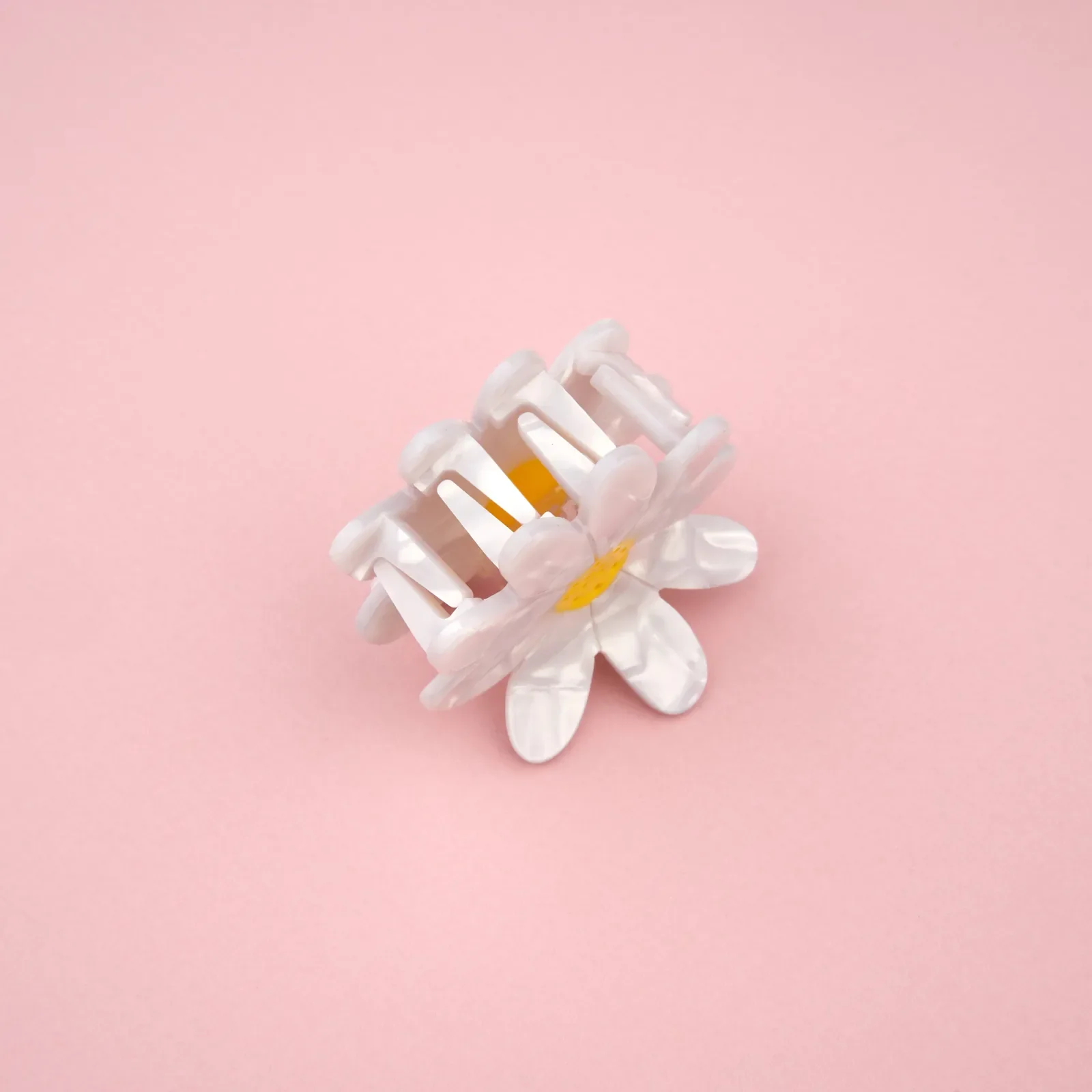 Coucou Suzette Daisy Hair Claw in glossy cellulose acetate, a sweet French flower hair accessory curated by Goosebump.
