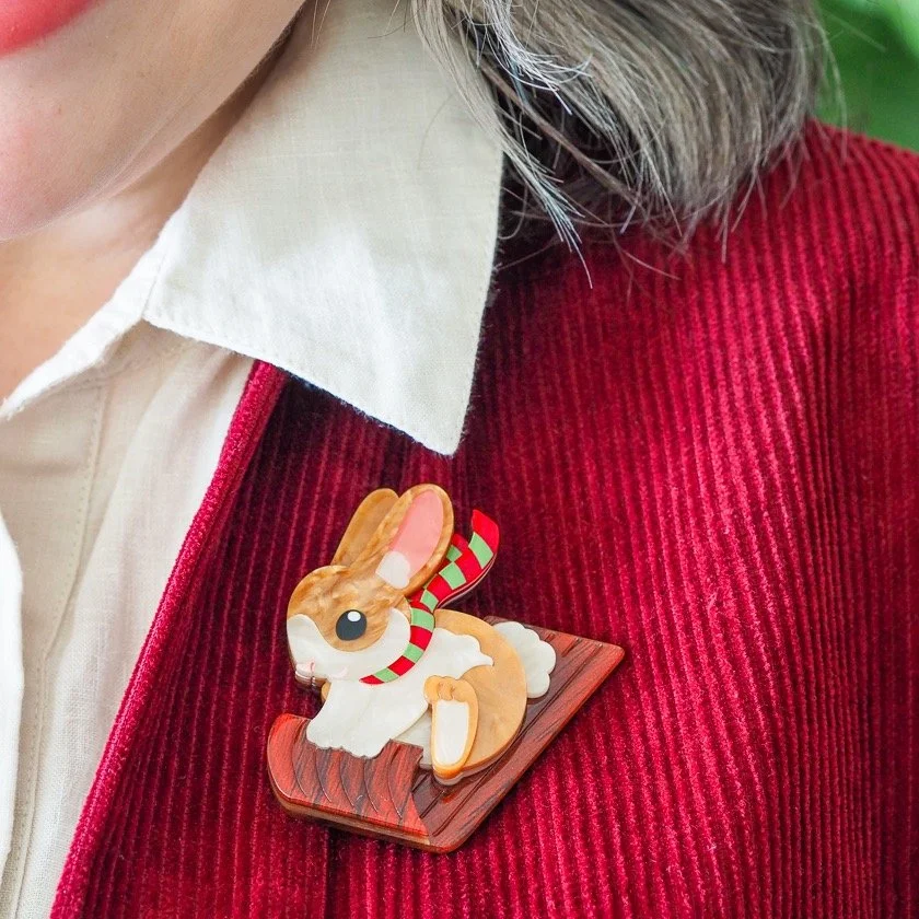 Breezy the Bunny Brooch by Erstwilder — cute pastel bunny wearing winter bow, handmade layered resin. Perfect for soft-aesthetic Christmas gifting. Exclusive at Goosebump Hong Kong.