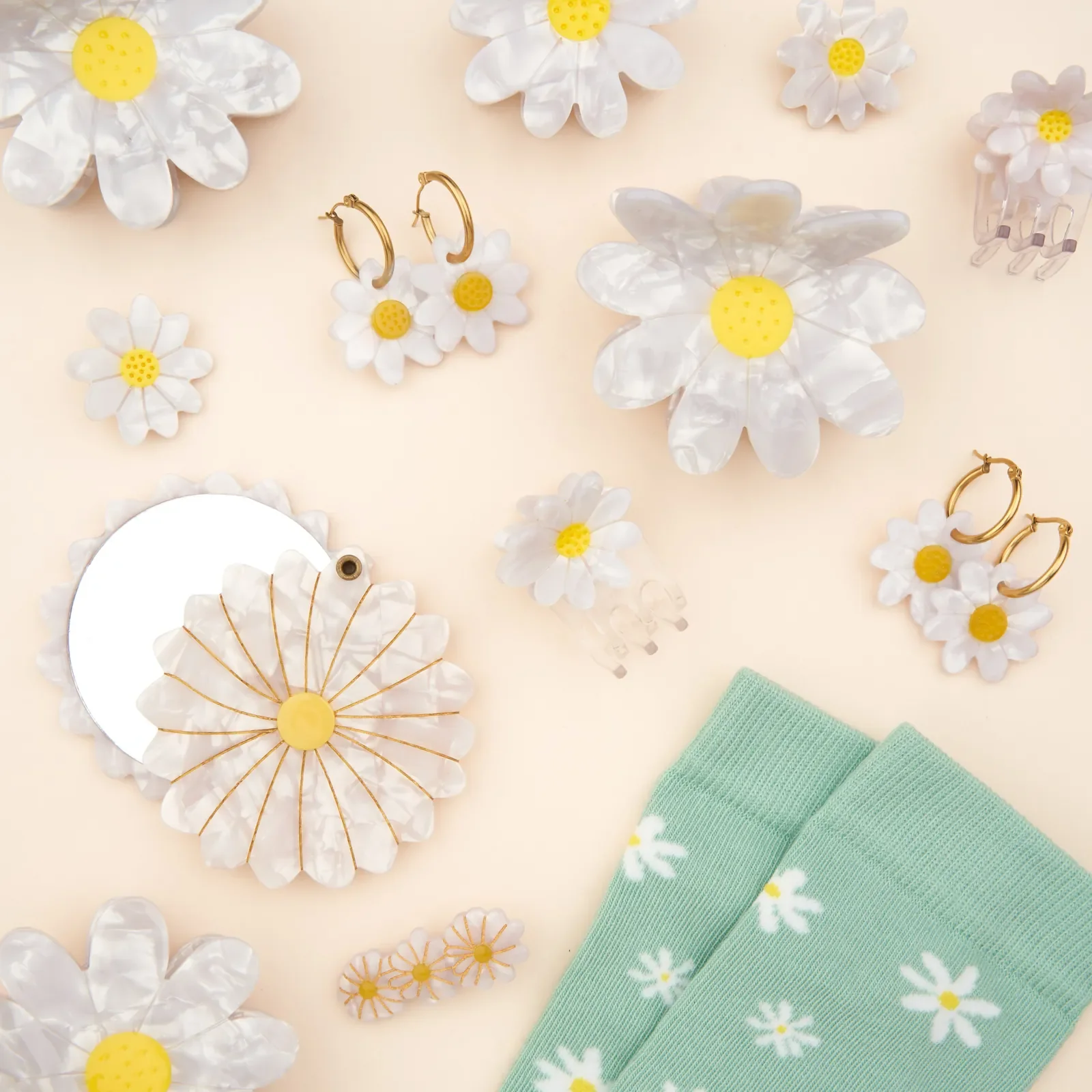 Coucou Suzette Mini Daisy Hair Claw in glossy cellulose acetate, a sweet French flower hair accessory curated by Goosebump.