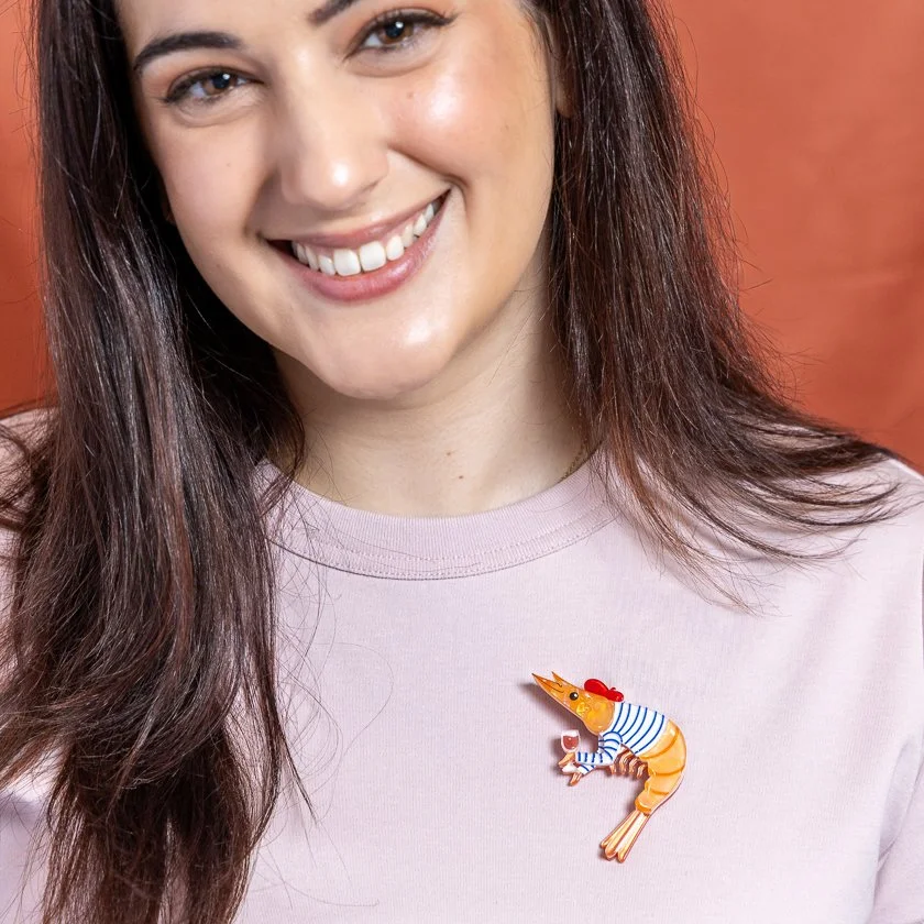 Erstwilder Pascal the Parisian Prawn Brooch featuring an orange prawn in a striped top and red beret