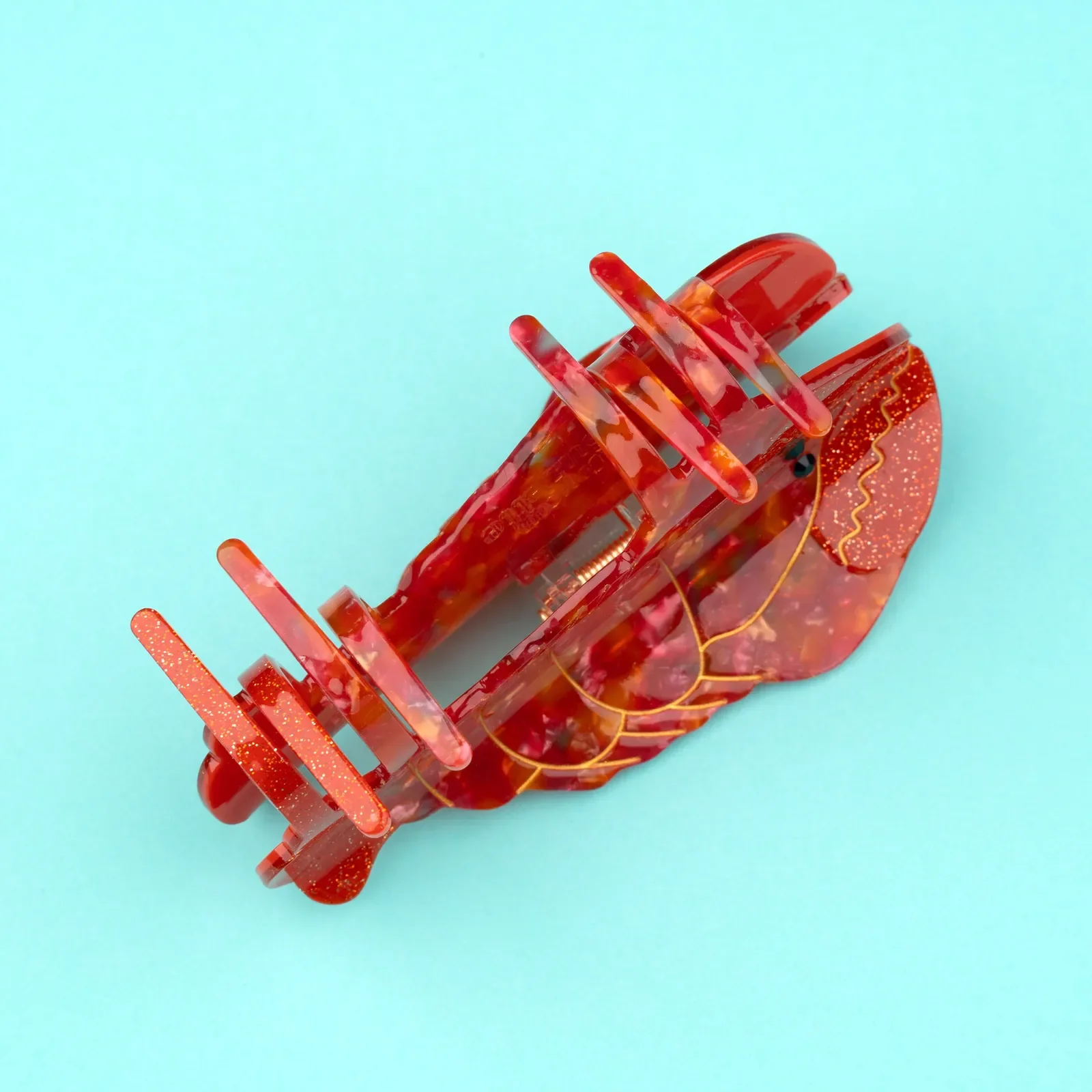 Coucou Suzette Lobster Hair Claw in glossy cellulose acetate, a bold sea-inspired French hair accessory curated by Goosebump.