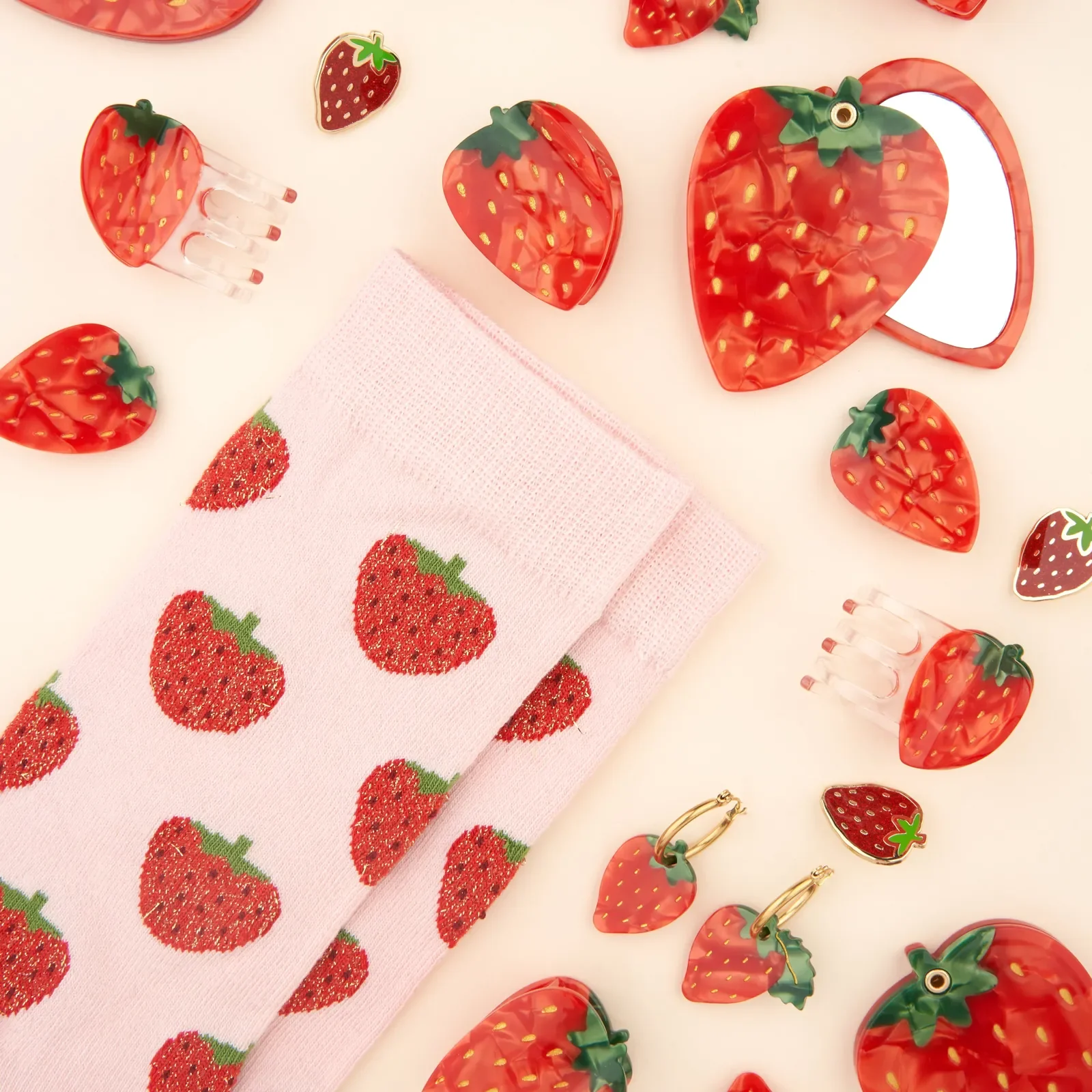 Coucou Suzette Strawberry Hair Claw in glossy cellulose acetate, a playful French fruit-inspired hair accessory curated by Goosebump.