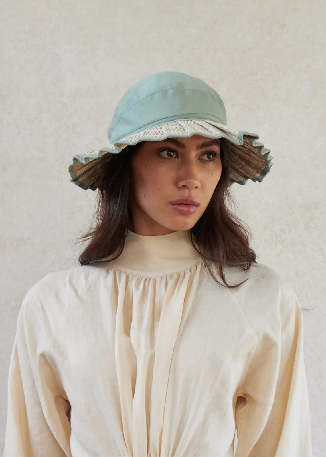Model wearing the Lorna Murray Polynesia Island Oasis Hat, showcasing its handcrafted woven design and certified UPF 50+ sun protection.
