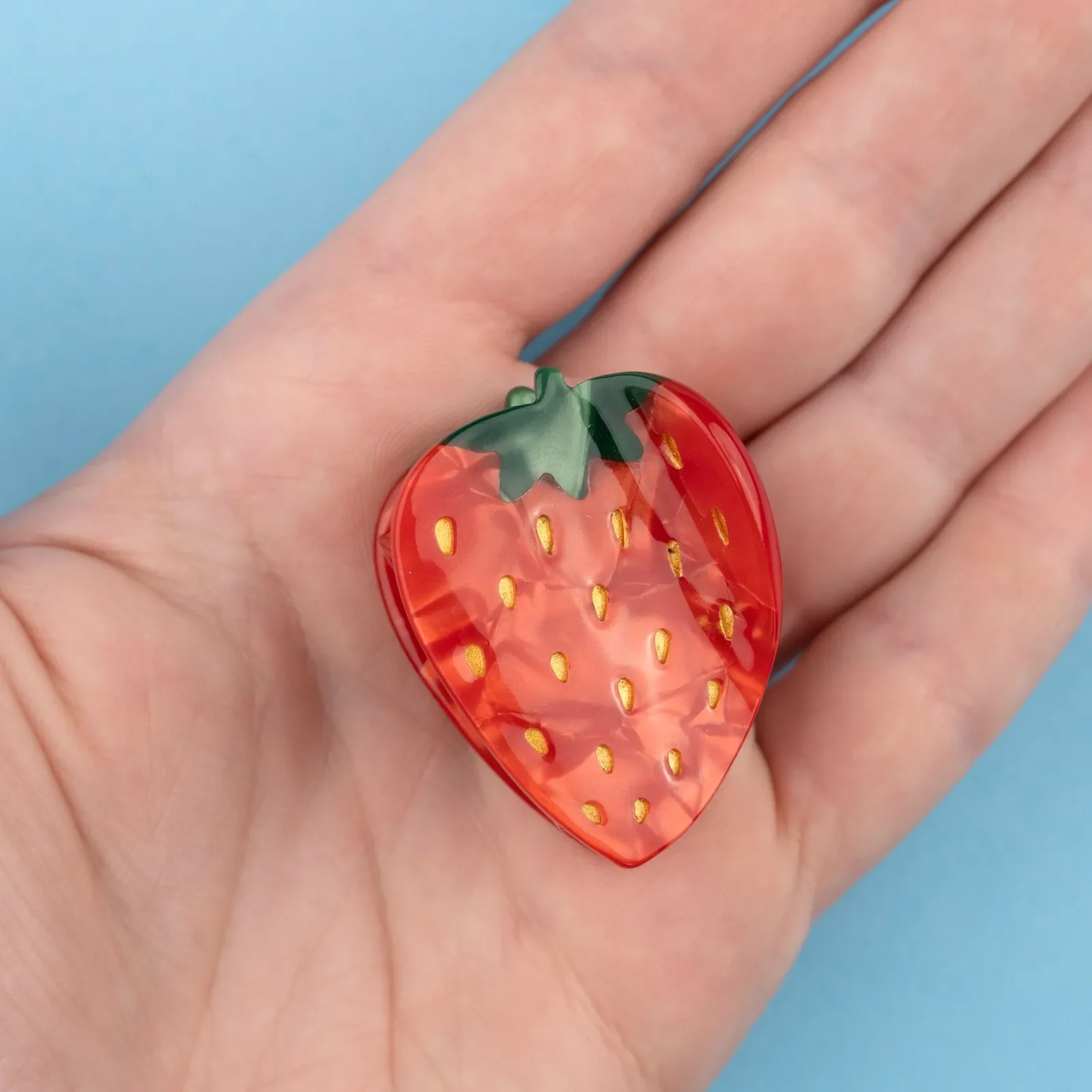 Coucou Suzette Strawberry Hair Claw in glossy cellulose acetate, a playful French fruit-inspired hair accessory curated by Goosebump.