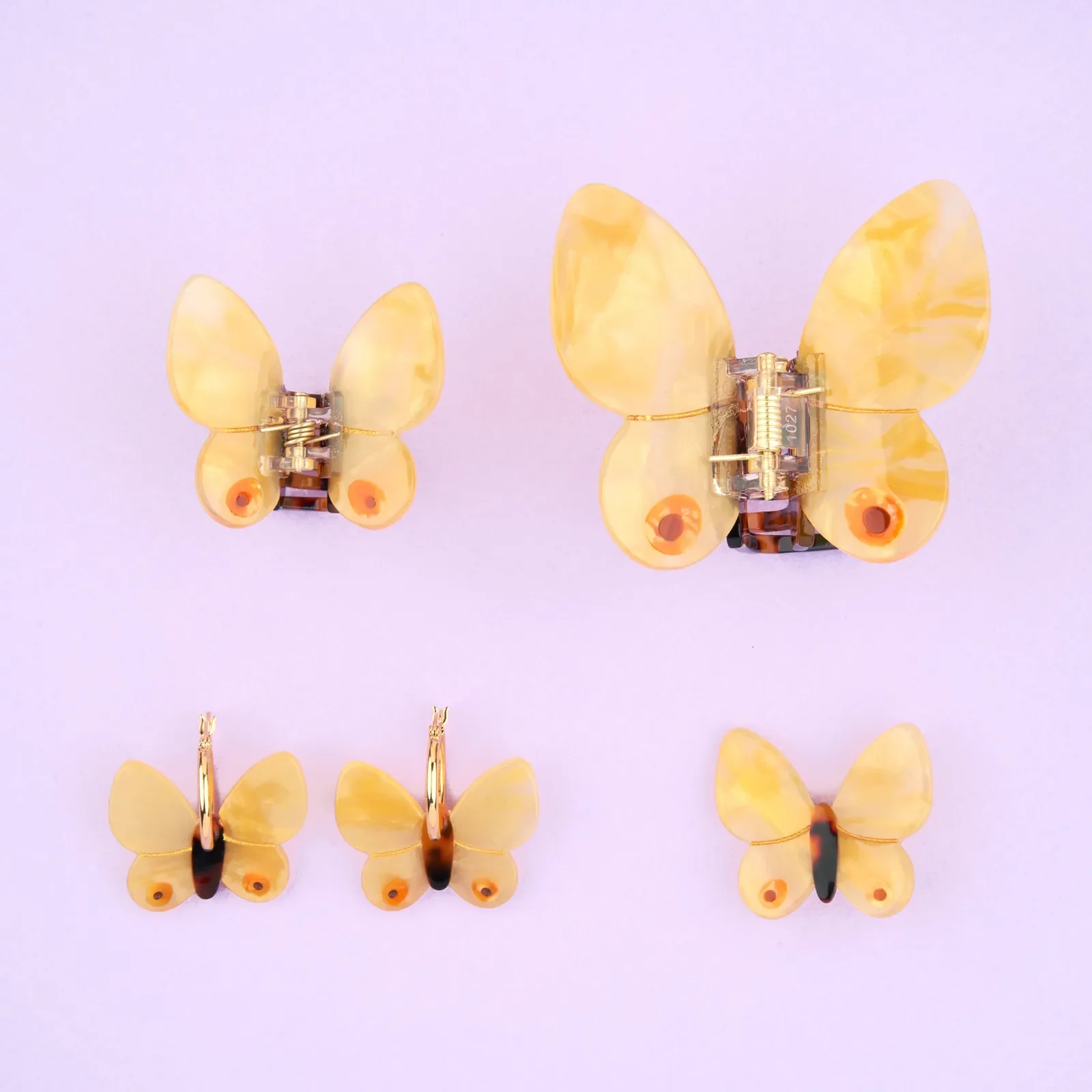 Coucou Suzette Yellow Butterfly Hair Claw in glossy cellulose acetate, a cheerful nature-inspired French hair accessory curated by Goosebump.