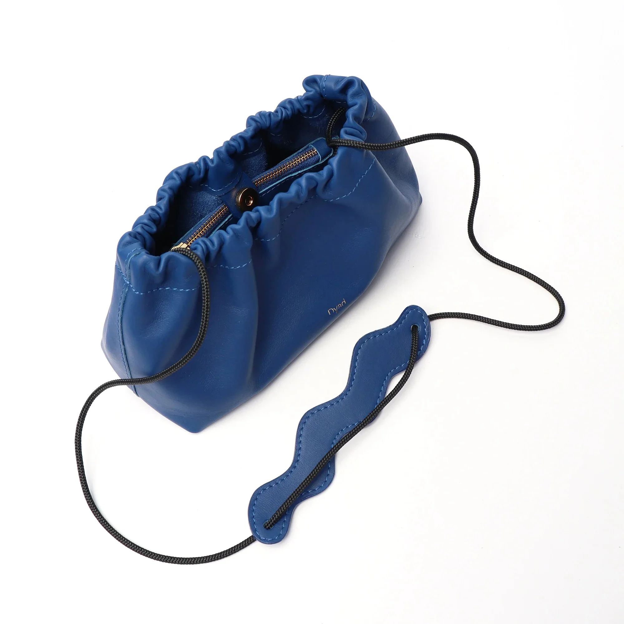 Wave Bag in cobalt blue canvas with sculptural folded silhouette, handmade in Cape Town by Project Dyad.