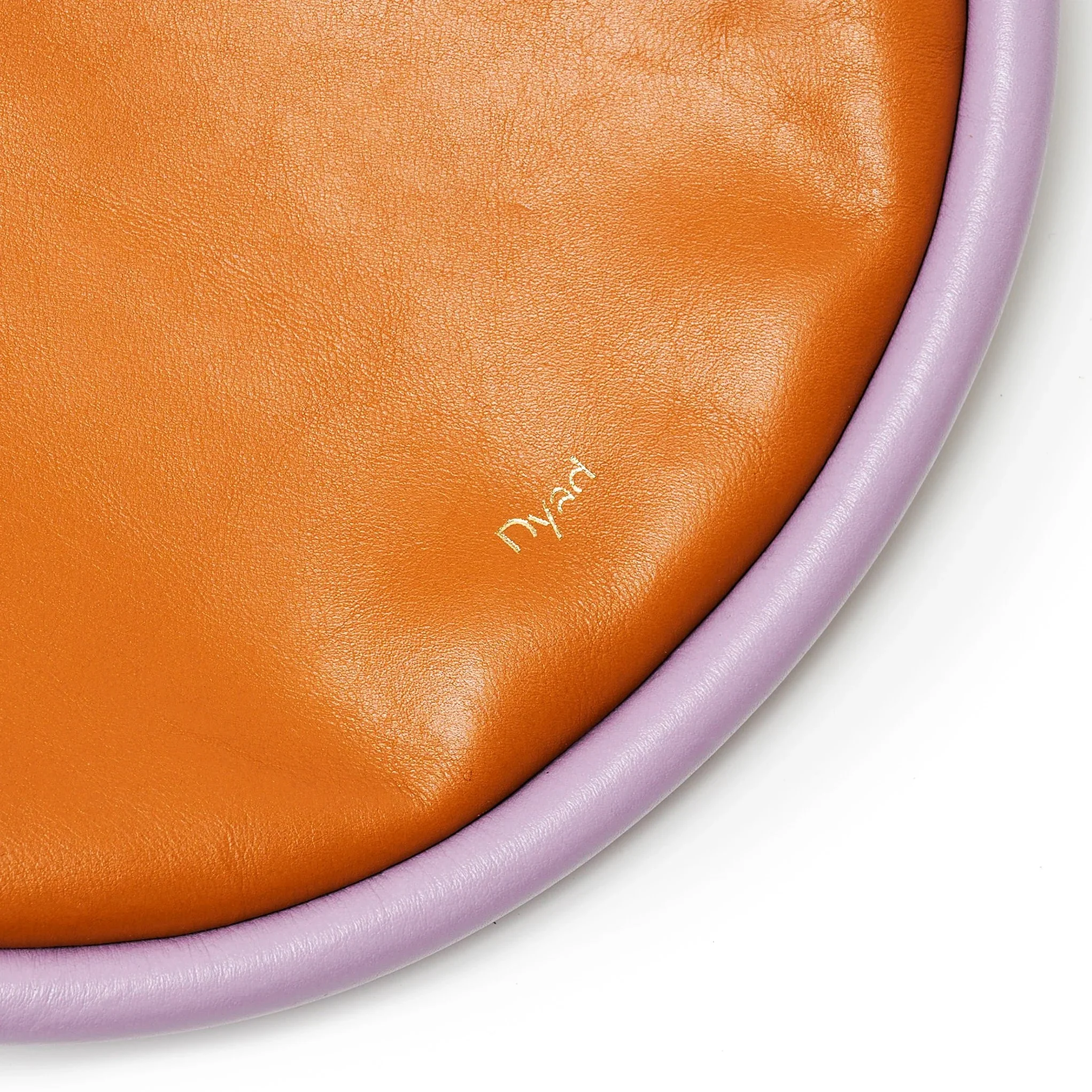 Selene Bag in tan and lilac colourway, sculptural folded silhouette with rope strap and short handles, handcrafted in South Africa.