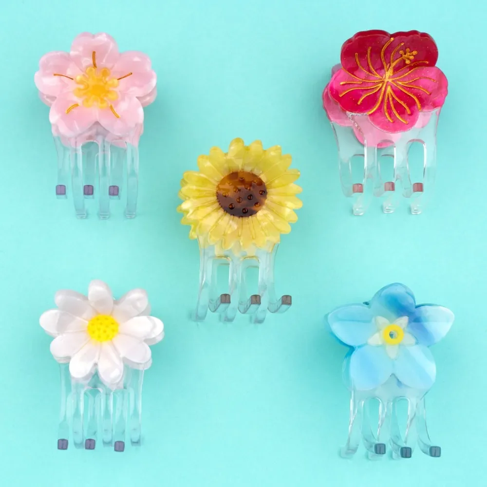 Coucou Suzette Mini Hibiscus Hair Claw in acrylic, a cheerful French flower hair accessory curated by Goosebump.