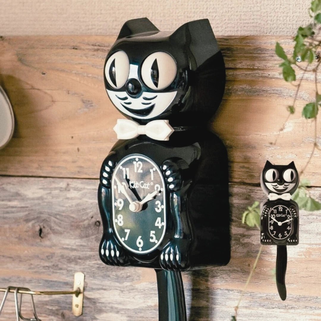 Classic Black Kit-Cat Klock retro wall clock with white bow tie, moving eyes and wagging tail, available at Goosebump Hong Kong.