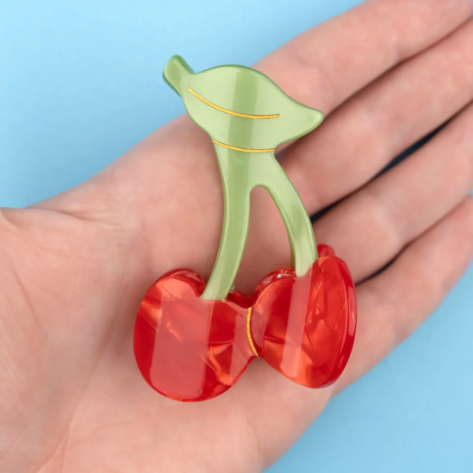 Coucou Suzette Cherry Hair Claw in glossy cellulose acetate, a playful French fruit-inspired hair accessory curated by Goosebump.