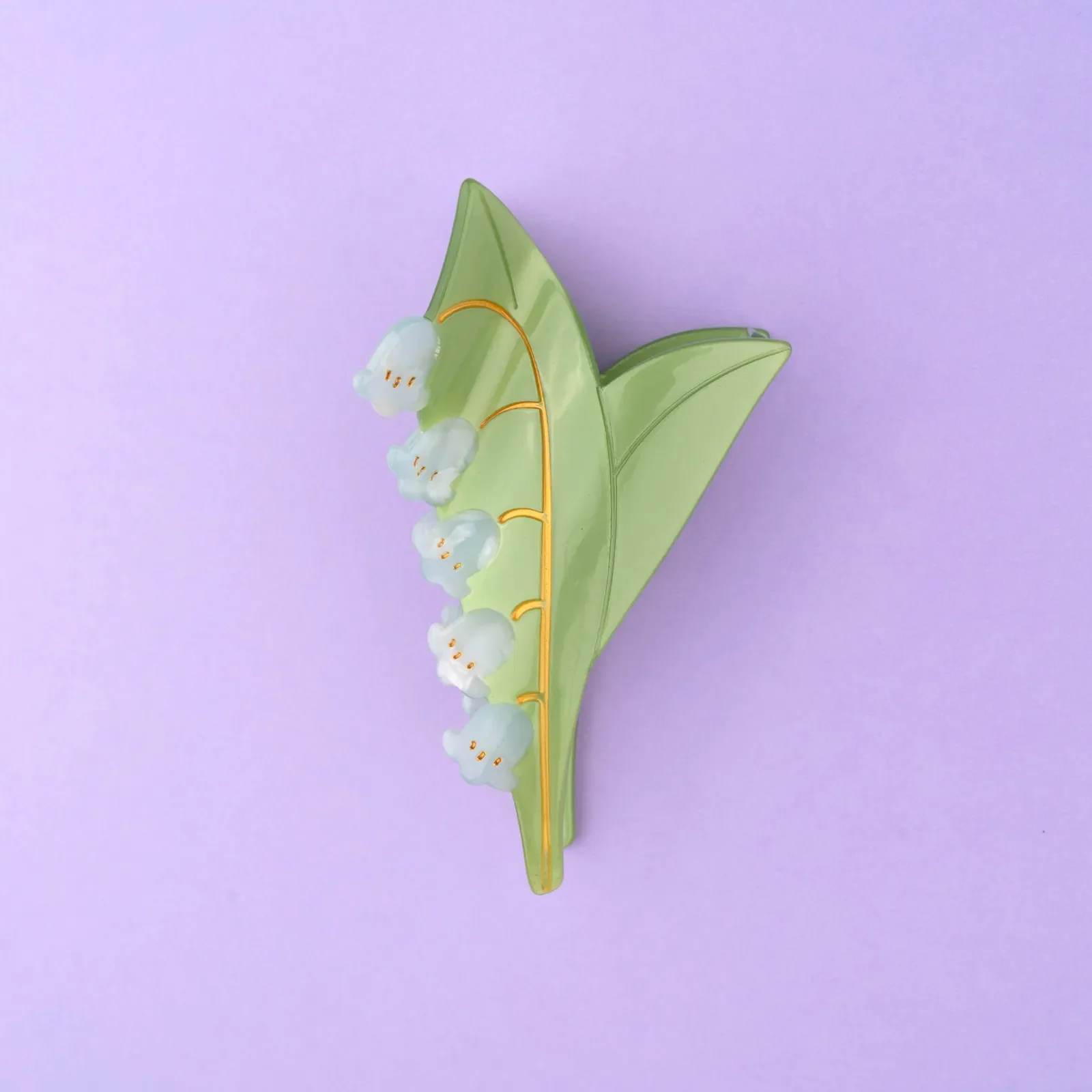 Coucou Suzette Lily of the Valley Hair Claw in glossy cellulose acetate, a delicate French flower hair accessory curated by Goosebump.