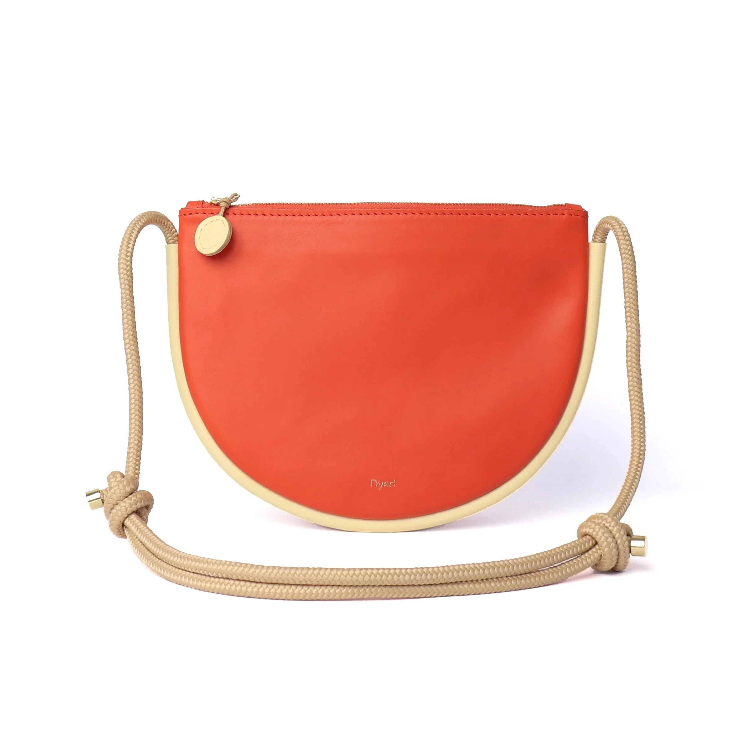 Selene Bag in Lobster Red and Butter – handcrafted leather sling bag with crescent shape and adjustable rope strap, designed by Project Dyad