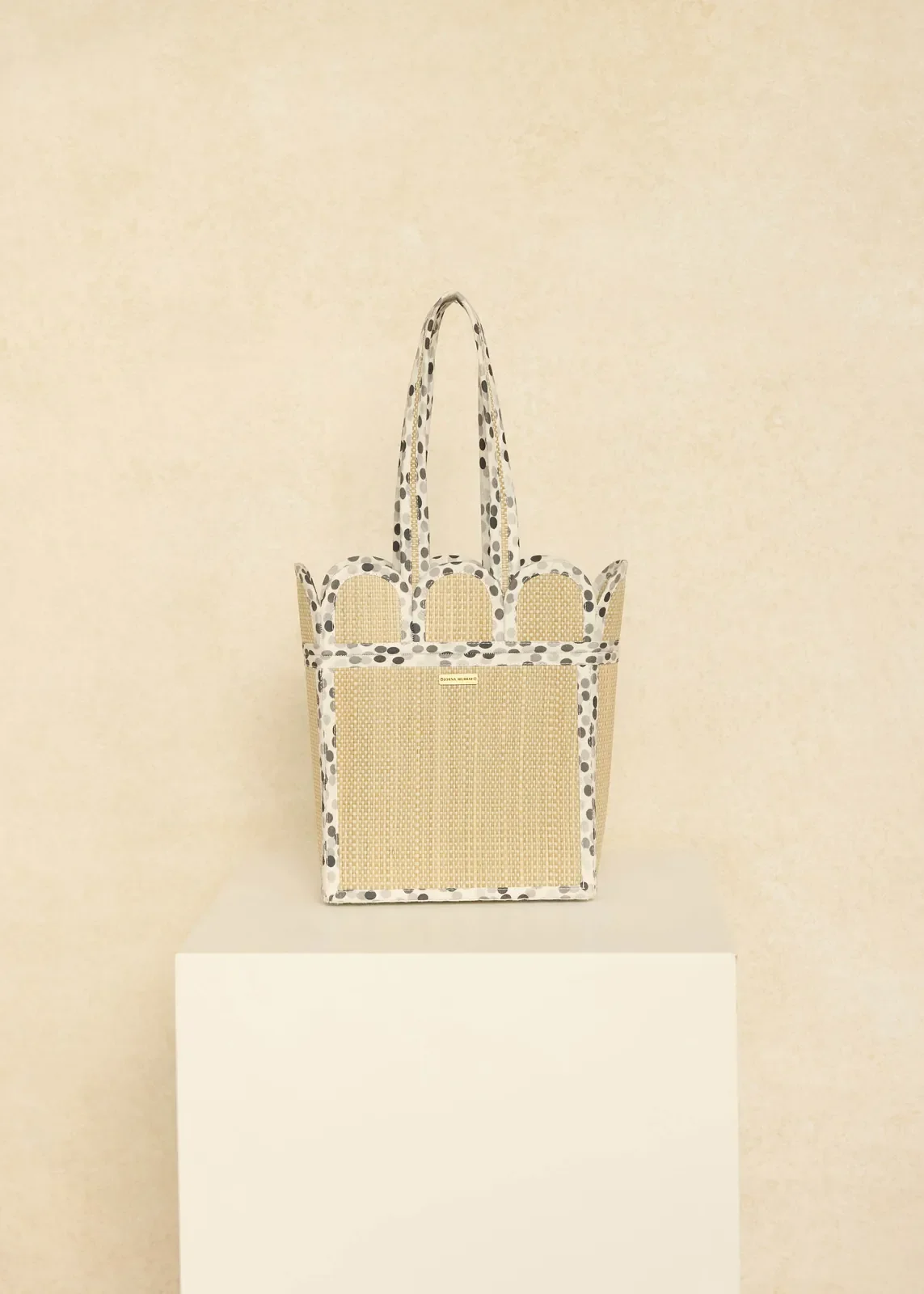 Lorna Murray Polka Monochrome Mini Scallop Tote front view in handwoven natural organic grass fibres with a scalloped silhouette.