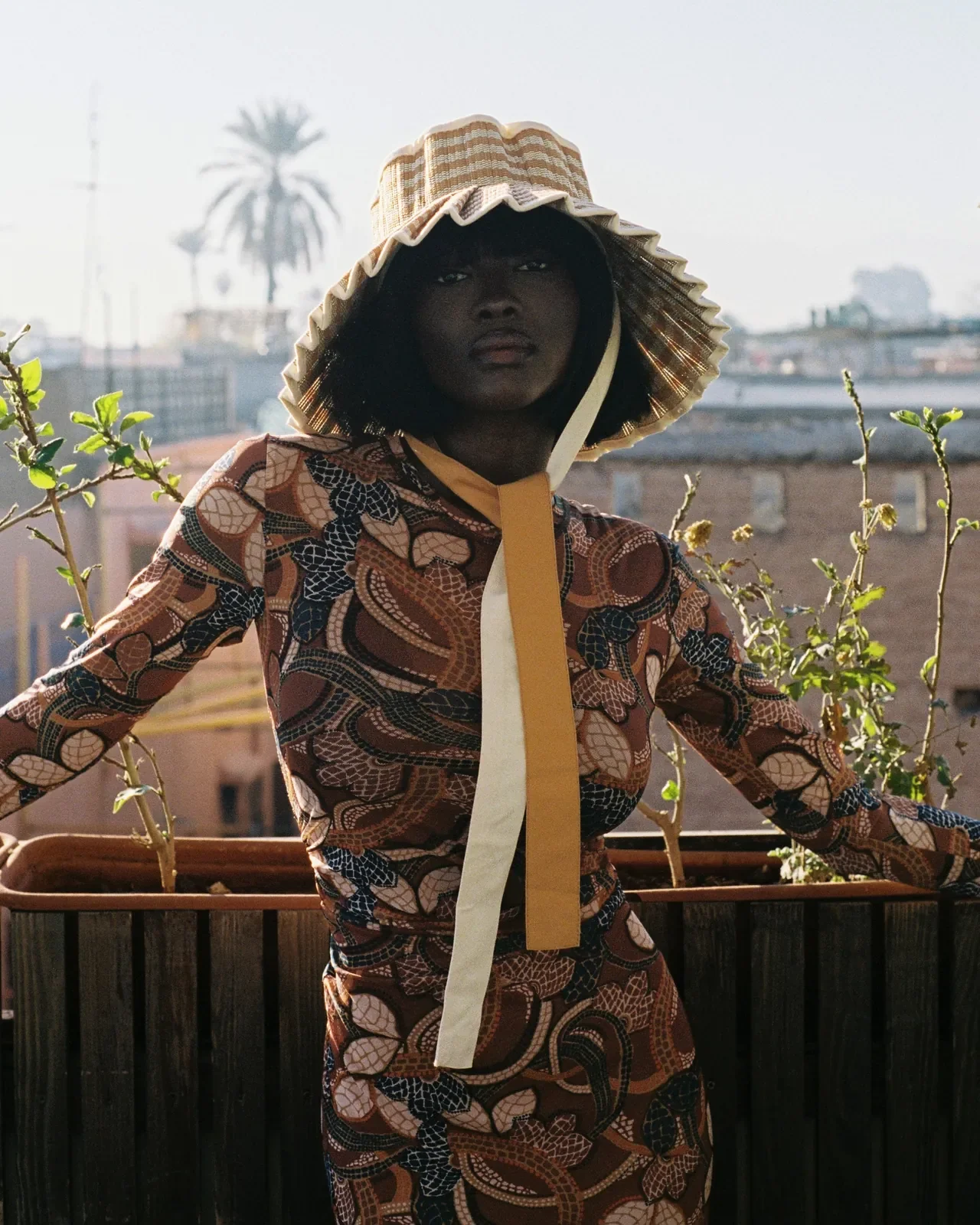 Model wearing the Lorna Murray Sundream Island Ravello Hat outdoors, showcasing its lightweight handcrafted design and everyday sun protection.