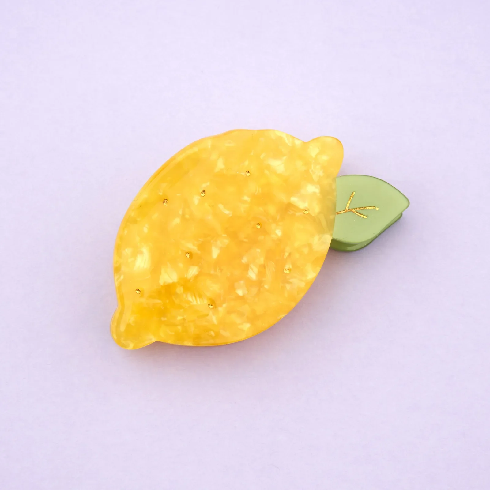 Coucou Suzette Lemon Hair Claw in glossy cellulose acetate, a cheerful French fruit-inspired hair accessory curated by Goosebump.
