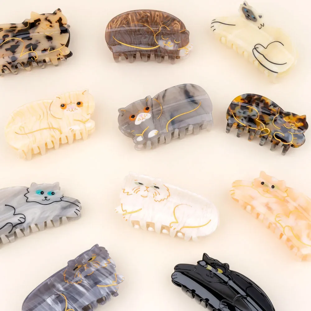 Sleeping cat hair claw by Coucou Suzette in glossy cellulose acetate.