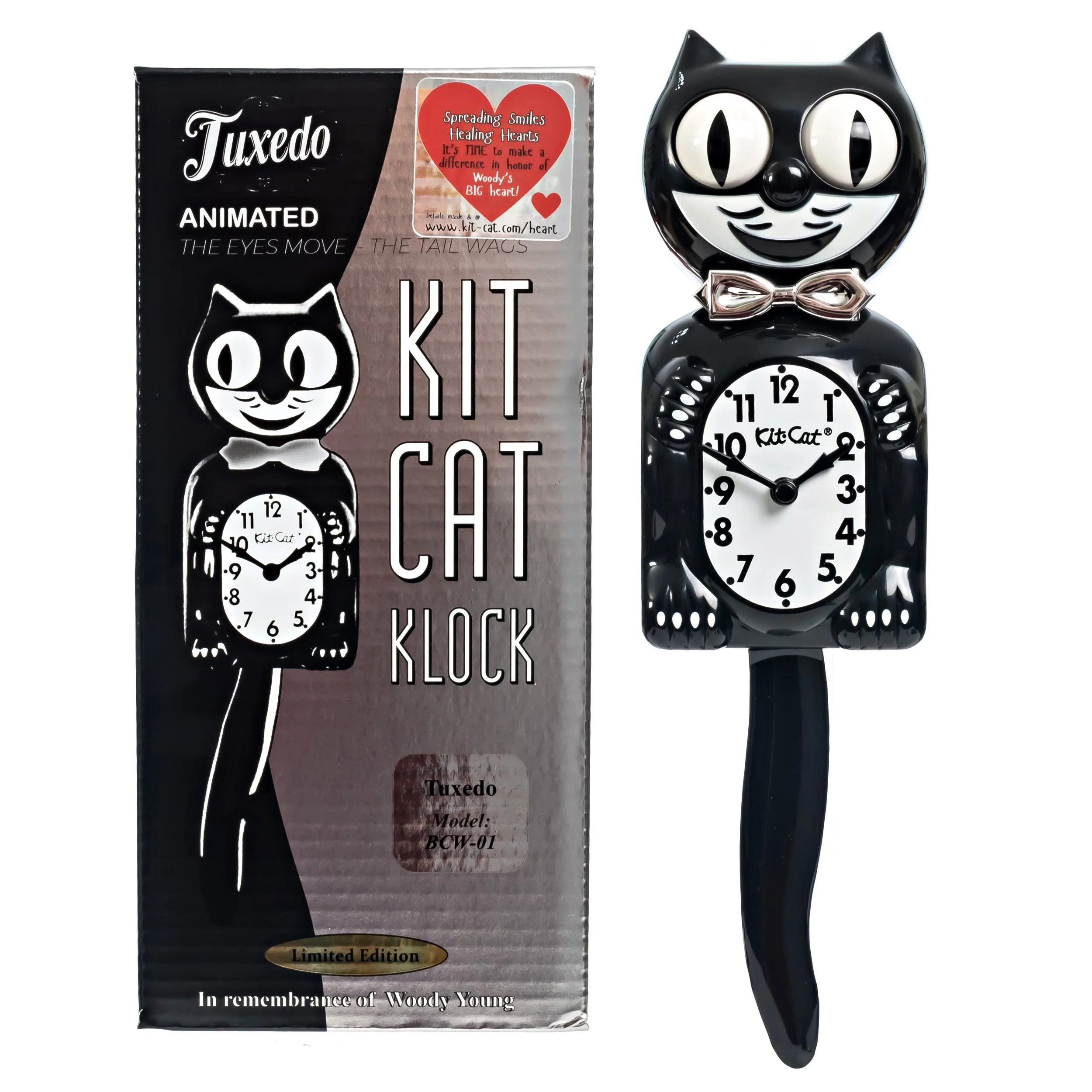 Tuxedo Kit-Cat Klock with black body, ivory belly, chrome bow tie, moving eyes and wagging tail, available at Goosebump Hong Kong.