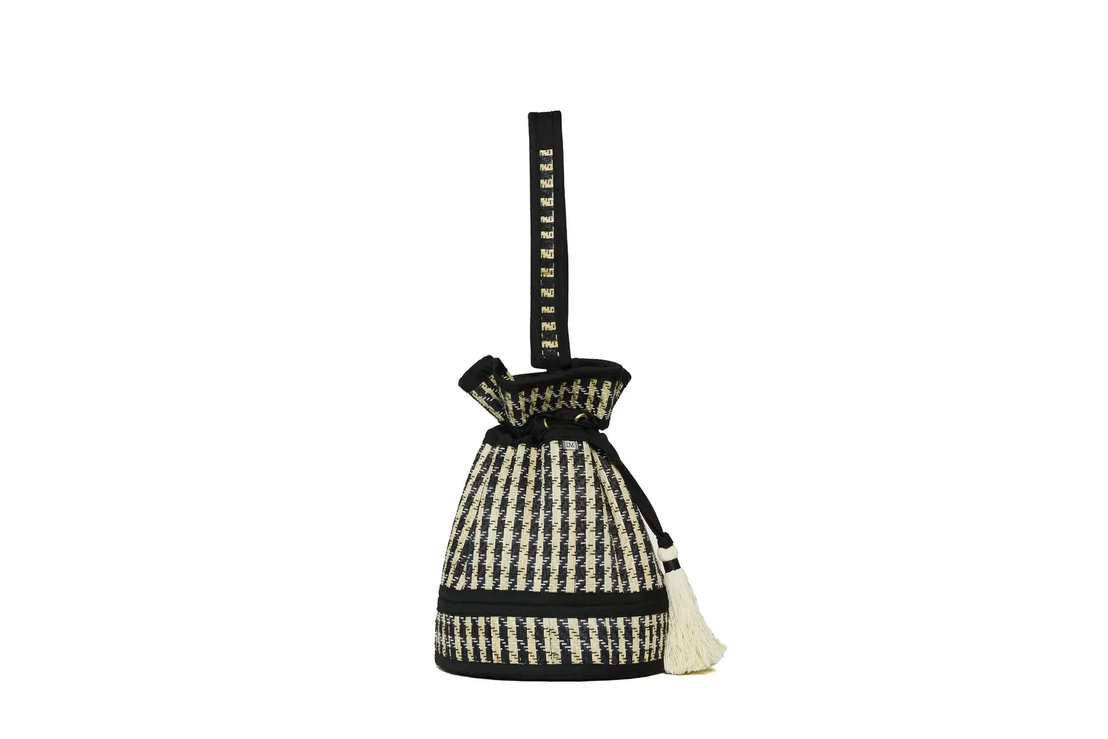 Side view of the Lorna Murray Roma Island Mini Leisure Tote showcasing its compact silhouette, detachable woven handle and natural grass fibre construction.