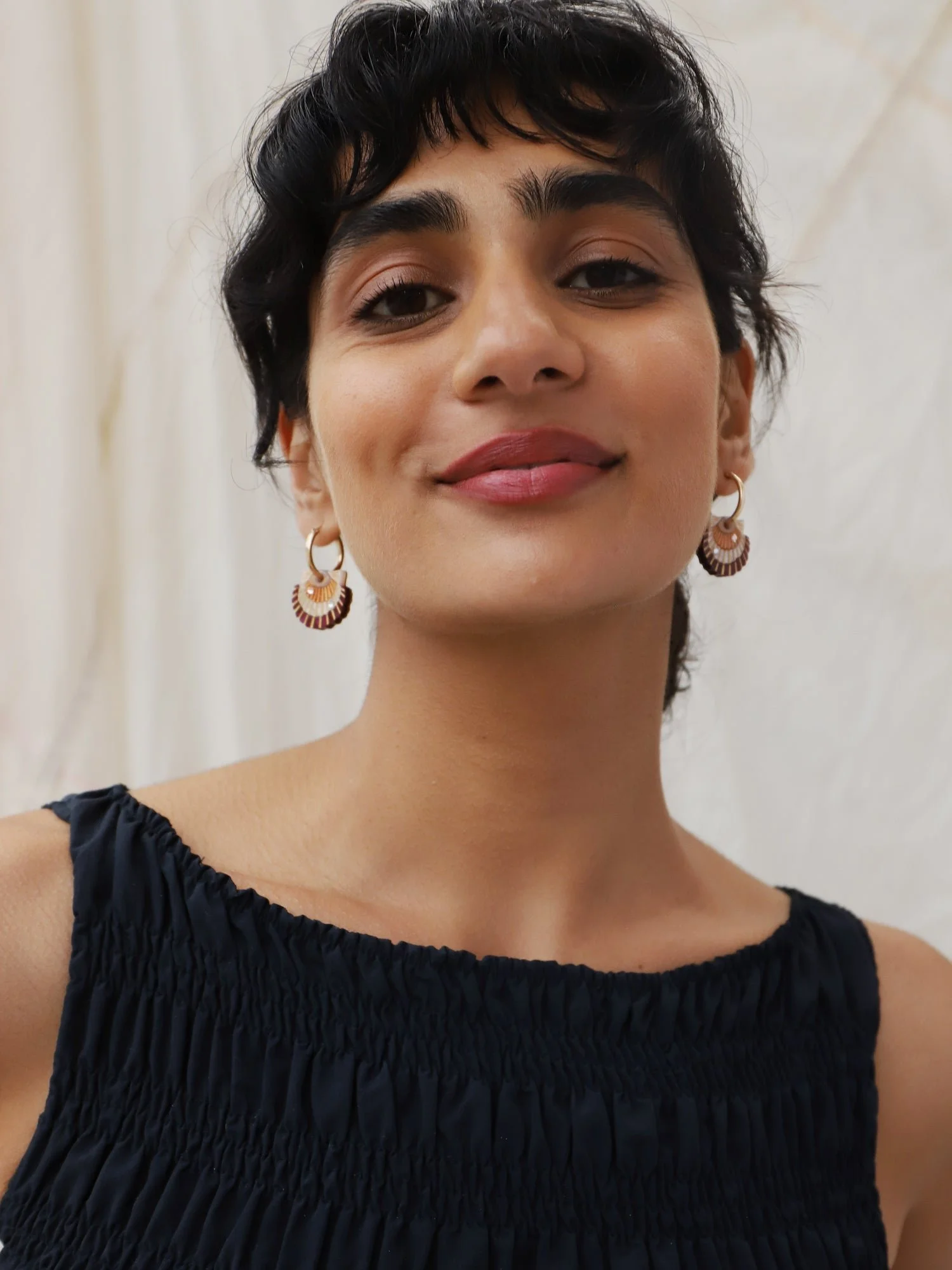 Wolf & Moon Scallop Shell Hoops with peach and cream scallop shell charms, acrylic and wood construction, glass crystal details and gold-filled hoops.