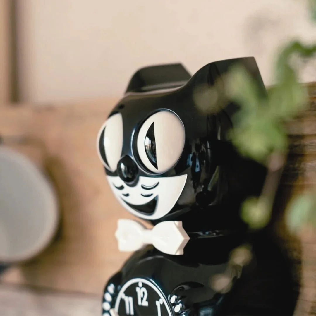 Classic Black Kit-Cat Klock retro wall clock with white bow tie, moving eyes and wagging tail, available at Goosebump Hong Kong.