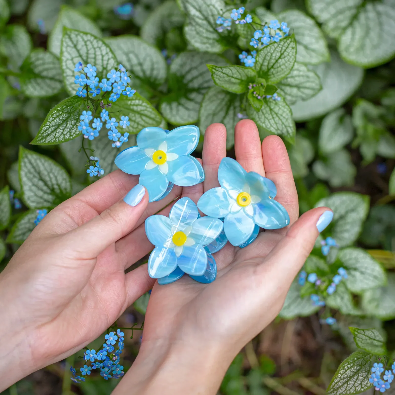 Coucou Suzette Forget-Me-Not Hair Claw in glossy cellulose acetate, a delicate French flower hair accessory curated by Goosebump.