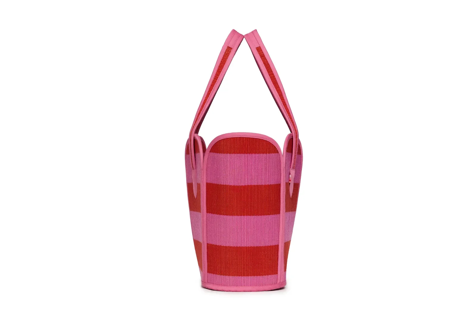 Side profile of the Lorna Murray Berry Bomb Vacation Tote highlighting its structured woven silhouette.