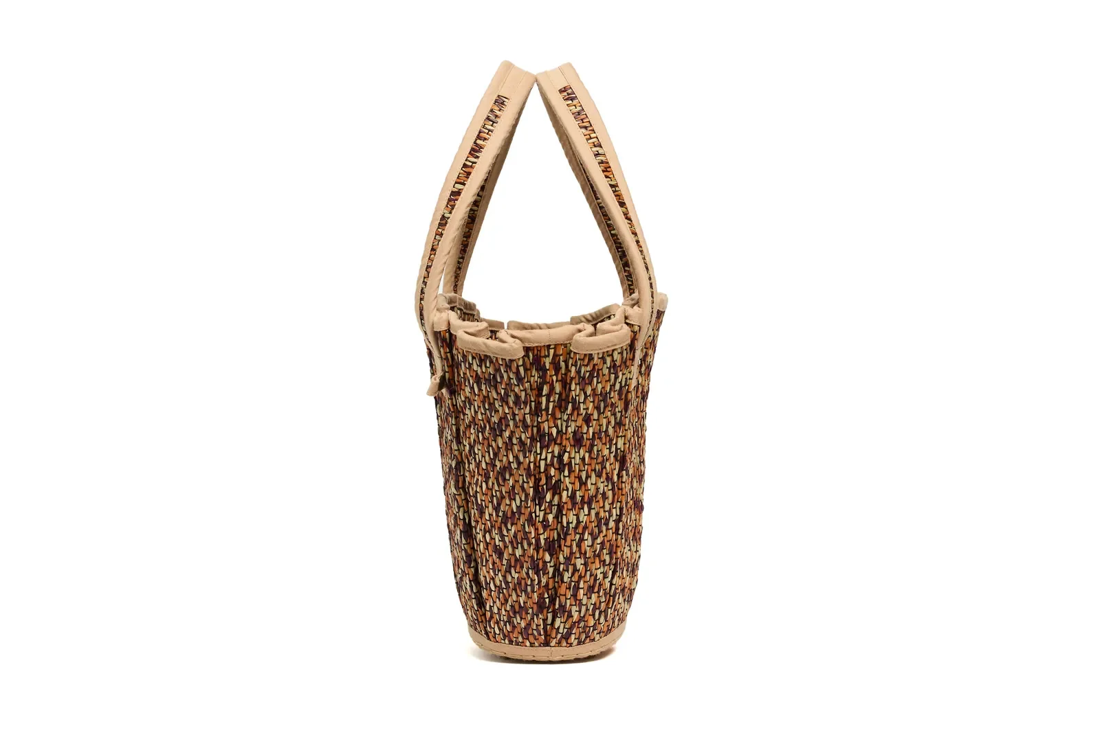 Side profile of the Lorna Murray Dawn Mini Tropez Tote Bag highlighting its compact proportions and woven craftsmanship.