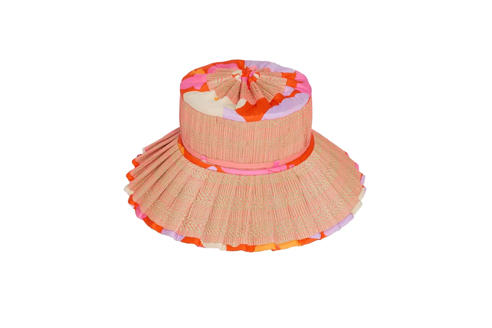 Angled view of the Lorna Murray Longboard Island Capri Play Hat highlighting its natural grass fibre weave and Liberty Fabrics accents.