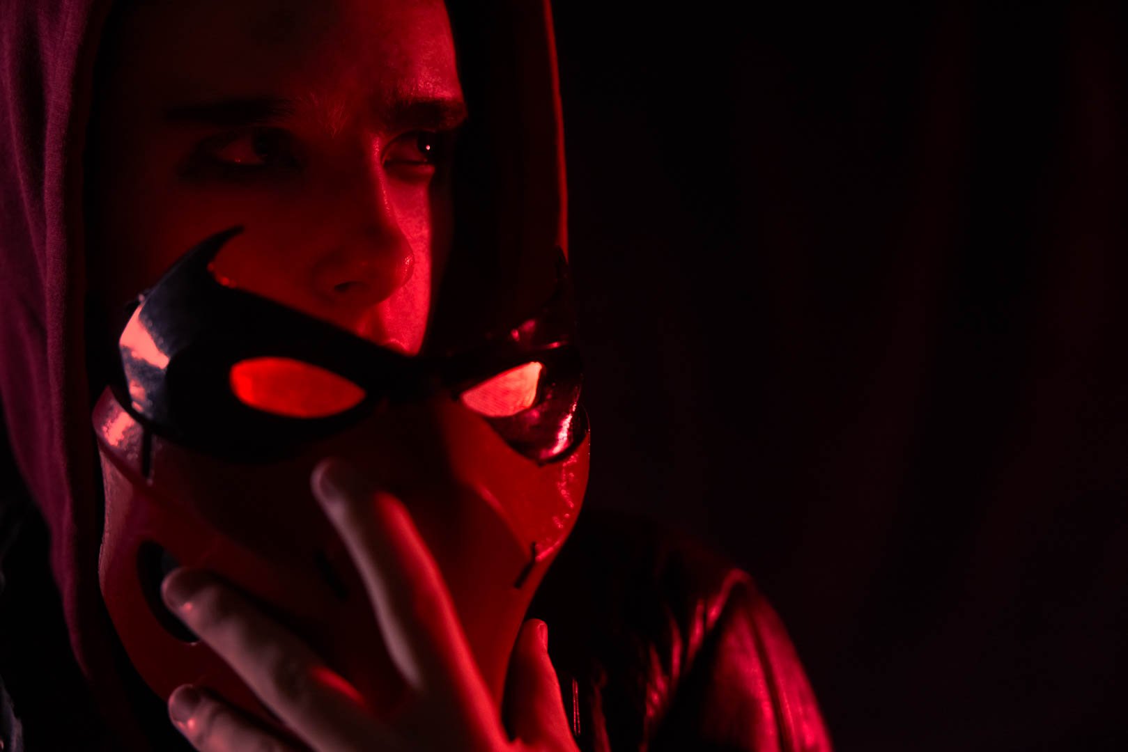 Red Hood DC cosplay photography with red gel lighting by Sian T. Photography, Cranleigh Surrey