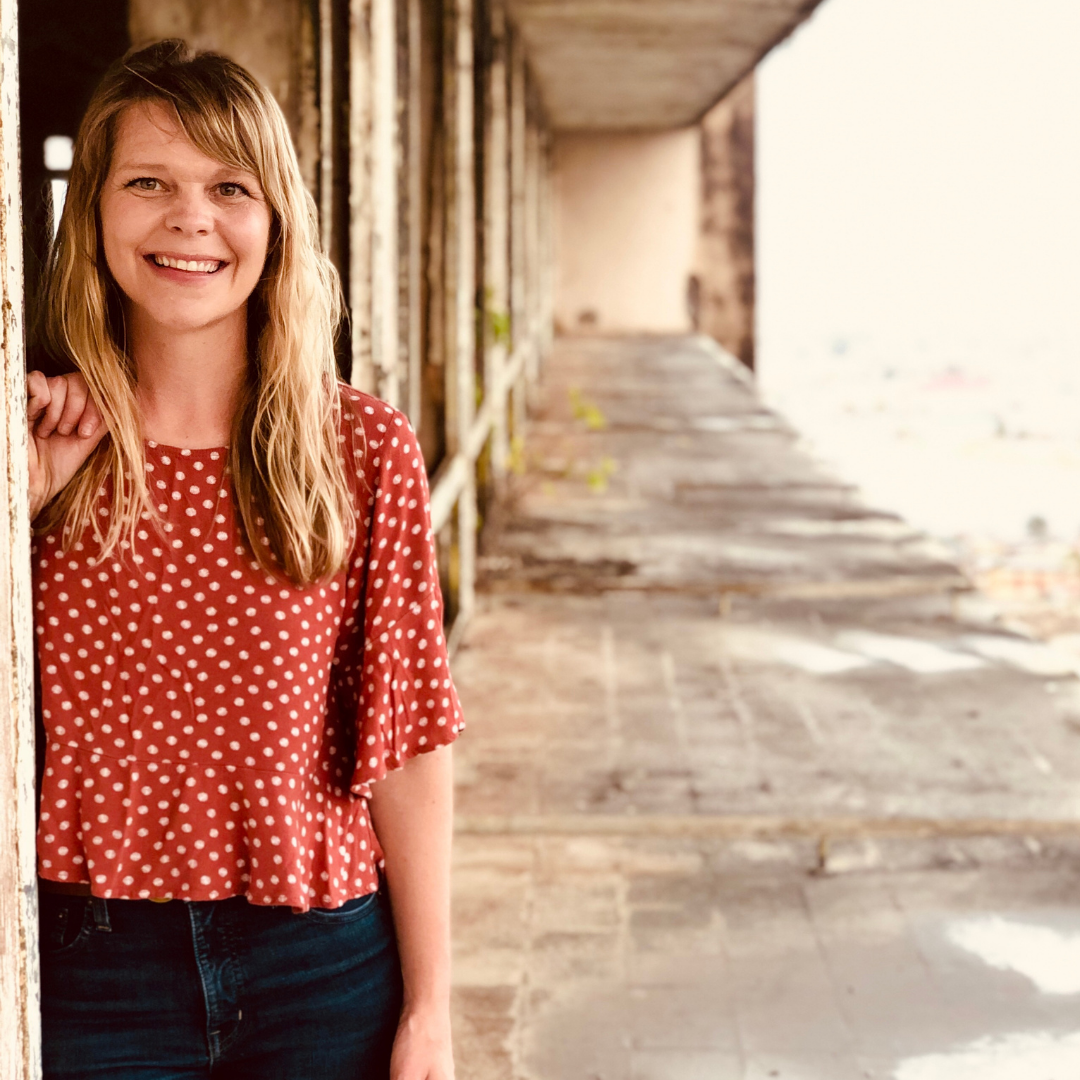Founder: Kara Kelly, pictured here in a building that was hit by a bomb, but still standing.