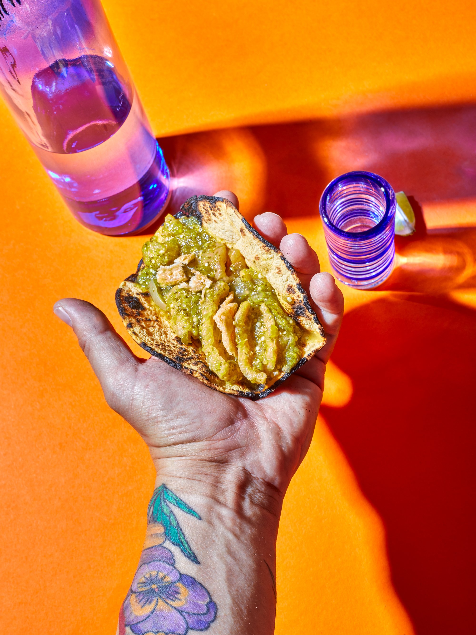 oakland-food-photographer-chicharron-en-salsa-verde-hand-holding-taco.jpg