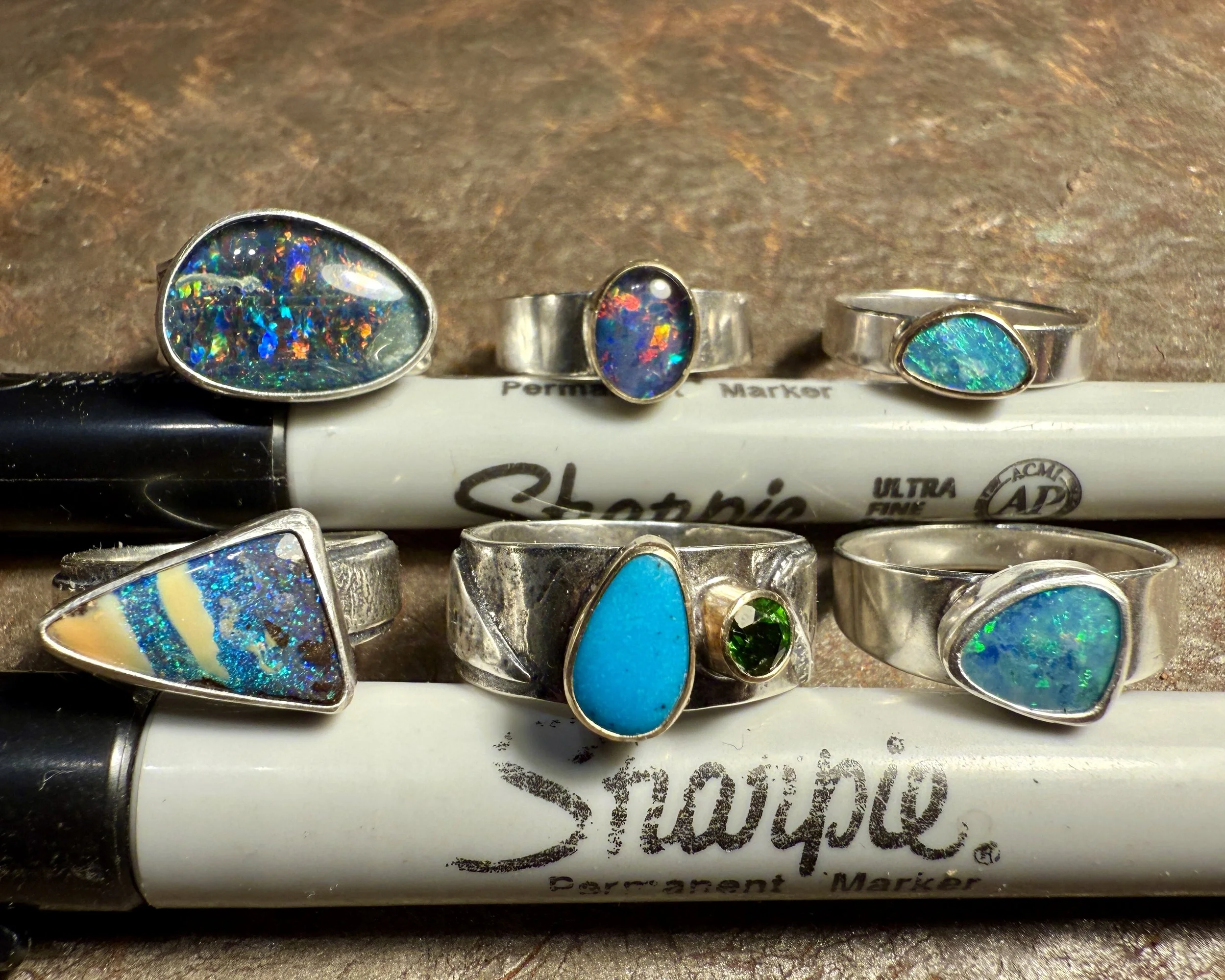December 16, 2025 - New pretties I finished making today. No fancy theme this time. I just felt like making pretty baubles for fingers. The faceted green stone in the one with the turquoise is chrome diopside (one of my favorite stones) and the turqu