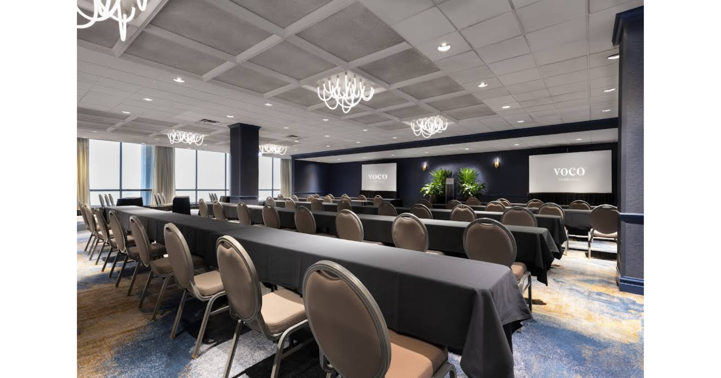 Photo of a hotel conference room set up for speakers