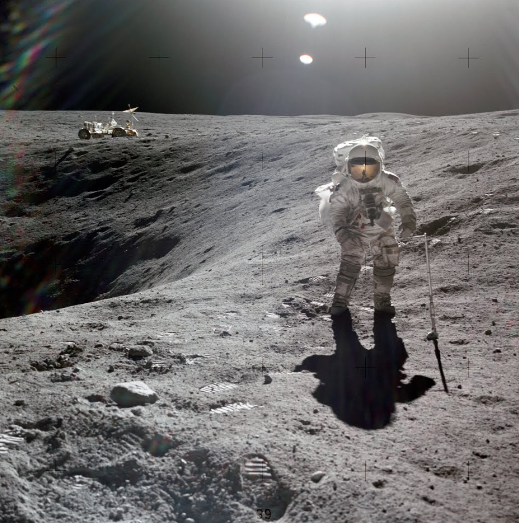 Astronaut Charles Duke photographed collecting lunar samples at Station 1