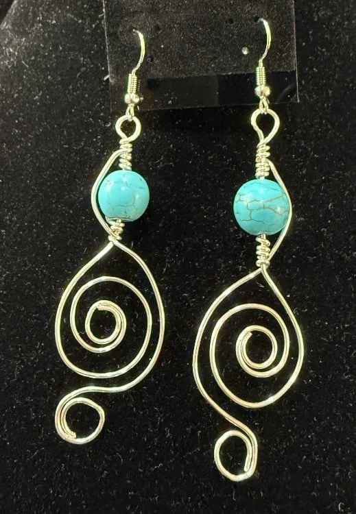 793-26;Earrings;’HistoricOldSantaFeInAg&TurquoiseNugget’;UniqueHandCraftedFreeFormDesignInAgRoundWireShapedIntoLarge&SmallOpenReverseSpiralsWithLargeRealTurquoiseNugget;EarHooksAreAgWithAgBallAndSpring.(1 of 1)